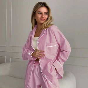 Women pink gingham pajama set with long sleeve button-down top and matching trousers