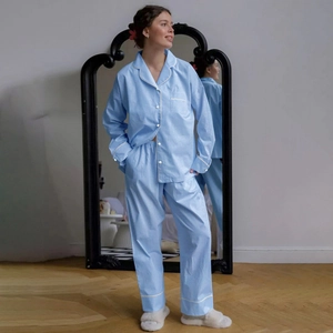 Women's light blue plaid pajama set featuring long-sleeve shirt and matching pants