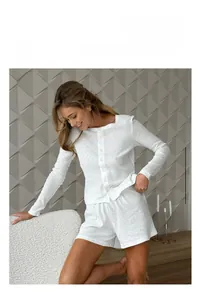 Detail of white cotton jacquard loungewear set featuring breathable textured knit fabric