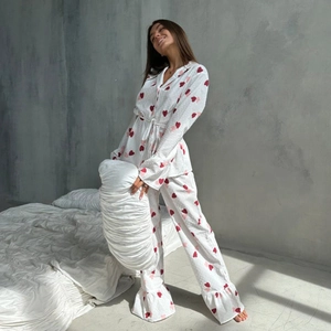 Women's white cotton heart print pajama set with long sleeves and ruffled hem details