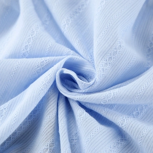 Light blue cotton jacquard pajama set featuring ribbed texture and hollow embroidery details