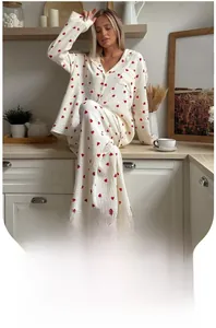 Detail of white button-down pajama set with red heart print and soft waffle texture