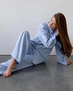Detail of light blue cotton long sleeve shirt and wide leg pants loungewear set for women