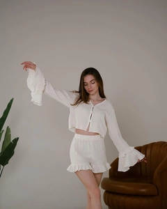 Detail showing ruffle cuffs on cream cotton loungewear and breathable pajama set