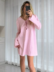 Detailed view of pink cotton nightdress featuring a V-neckline with tie-front closure