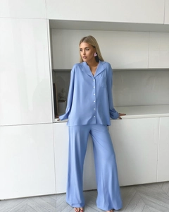 Full body view of light blue long-sleeved chiffon pajama set with silk texture and lapel