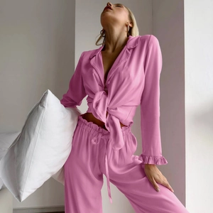 Pink ruffle pajama set for women including long sleeve button shirt and matching long pants