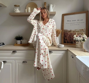 Detail of soft heart-print pajama set with button-down collar and chest pocket