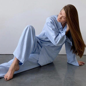 Women's blue cotton long-sleeve pajama set with button-down shirt and wide-leg pants