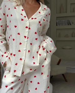 Detail showing the red heart print on soft white crinkle cotton pajama set fabric