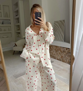 Close-up of heart print texture and button detail on cotton pajama set for women