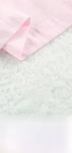 Detail showing the fine stitching and breathable cotton texture of pink loungewear