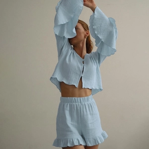 Light blue cotton pajama set featuring long sleeve ruffle top and elastic shorts