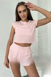 Detailed texture of pink pointelle knit short sleeve top and shorts pajama set