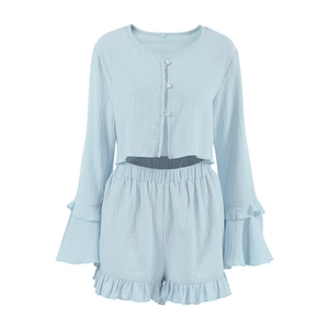 Light blue cotton gauze pajama set with long sleeves, ruffle trims, and button-up top