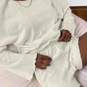 Women's cream knit pajama set with long sleeves, ruffle trim and pointelle textures