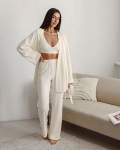 Detailed knit texture on a three-piece lounge set with long cardigan and wide-leg pants