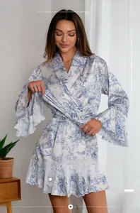 Detail of Toile de Jouy floral print on satin bathrobe with ruffle sleeve cuffs