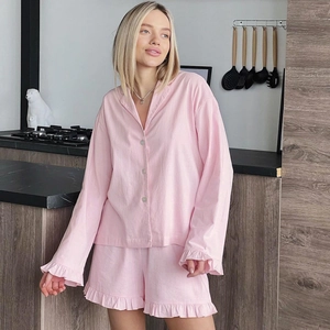 Women's light pink cotton long sleeve pajama set with ruffle shorts for loungewear