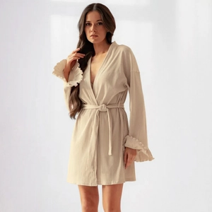 Women's beige knit robe featuring wide ruffle cuffs and a belted waist for home comfort