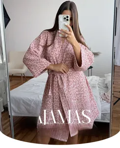 Close-up of pink leopard print cotton bathrobe with waist tie detail for women