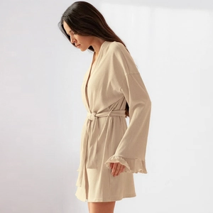 Women's minimalist waffle knit long sleeve robe with ruffled cuffs and waist tie
