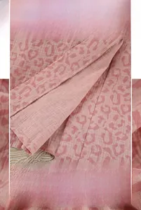 Detail view of pink leopard print cotton fabric with high-quality edge stitching and finish