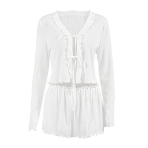 White two-piece pajama set with ruffled edges, ribbed knit texture and bow tie closure
