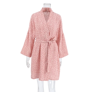 Close-up of pink leopard print cotton bathrobe with waist tie and V-neckline detail