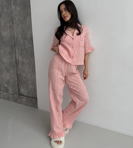 Pink leopard print pajama set with short sleeve button shirt and ruffle hem trousers