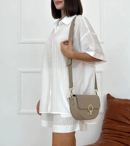 Detail of white vertical stripe texture on summer short sleeve pajamas and matching shorts