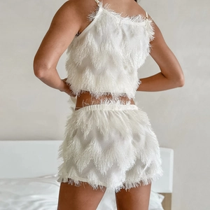 Women's chic two-piece pajama set with white fringe tassel top and matching shorts