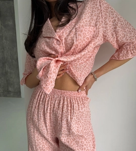 Detail of pink leopard print pajama set with waffle texture fabric and button closure