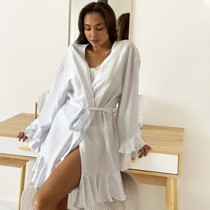 Elegant white satin robe with irregular ruffle hem and waist tie for a stylish home look