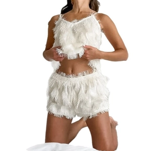 White two-piece pajama set with fringe tassels, featuring spaghetti strap top and shorts
