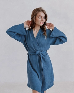 Detailed macro view of pure cotton muslin bathrobe with textured double gauze fabric