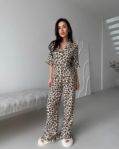Close-up of leopard print pajamas showing crinkled texture and ruffle sleeve details