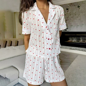 Women's white short-sleeve heart print pajama set with red buttons and lace trim