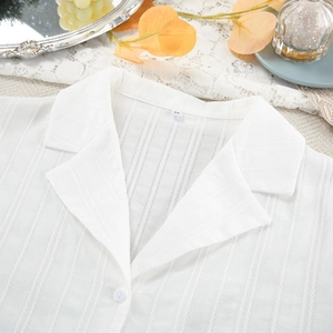Elegant white cotton jacquard cardigan and shorts set with delicate lace texture