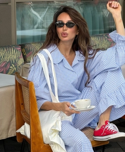 Detail of blue gingham two-piece set featuring long-sleeve shirt and lounge pants