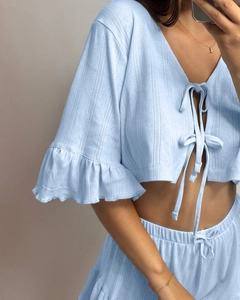 Detailed knit texture and ruffle cuffs of light blue lace-up pajama set for women