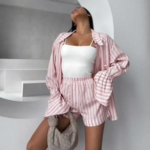 Pink striped two-piece loungewear set featuring a lapel long sleeve shirt and shorts