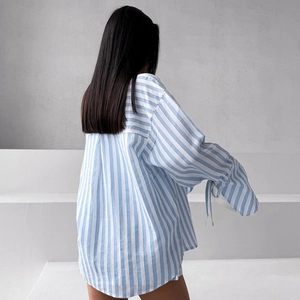 Women's blue striped oversized long-sleeved shirt with tie cuffs and casual fit
