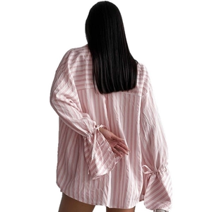 Pink and white striped long sleeve shirt with ruffled cuffs and tie detail for women