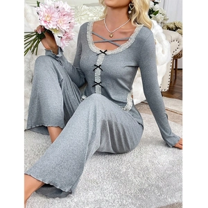 Women's grey rib-knit pajama set with lace trim and bow accents for home comfort