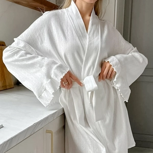 White long-sleeved knit bathrobe with textured jacquard stripes and ruffled cuffs