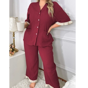 Women's two-piece wine red pajama set with short sleeve button top and ruffled pants