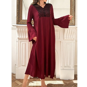 Detail of burgundy long sleeve nightgown featuring black lace embroidery and ruffle cuffs