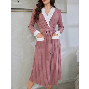 Detail of soft pink ribbed robe with white contrast lapel and waist tie belt closure