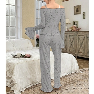 Chic grey polka dot pajama set featuring off-shoulder long sleeves and ruffled hem details
